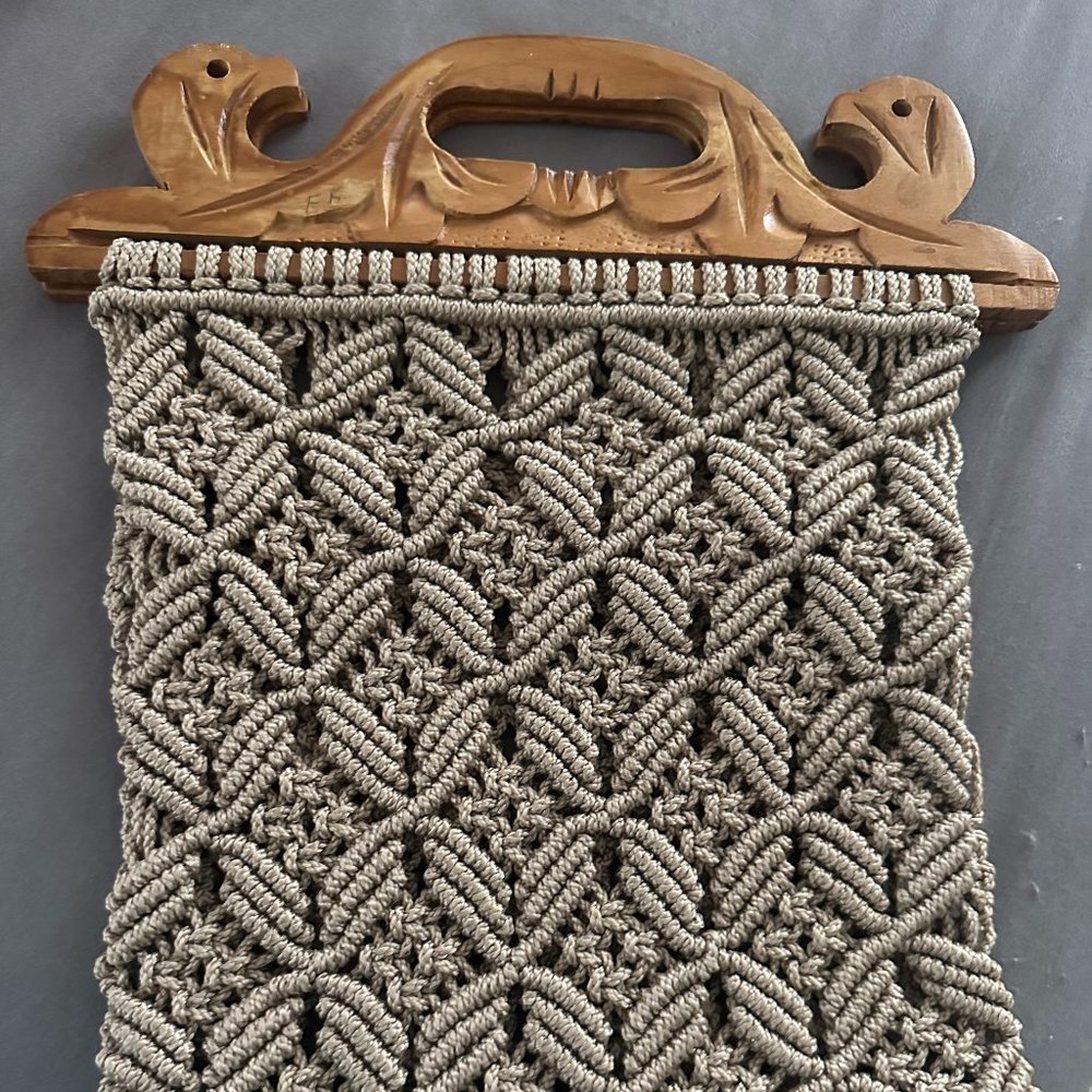 Unique Boho Macrame bag with detailed wood handle.